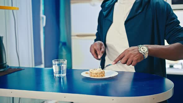 Happy Black Guy Eating Breakfast at Home