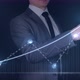 Businessman Draws a Graph of Growth on a Virtual Touchscreen Panel - VideoHive Item for Sale