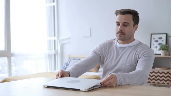 Creative Adult Man Coming for Doing Work on Laptop at Desk