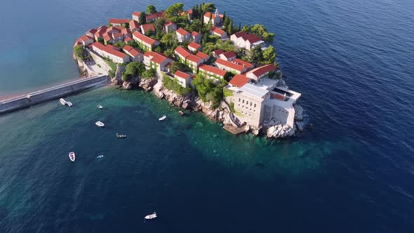 Flying Over Scenic Island on the Rock in the Sea