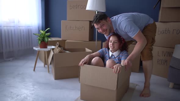 Happy Father and Daughter Celebrate the Completion of the Move to Their New Home