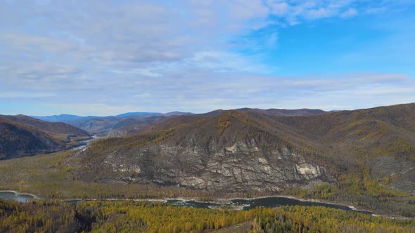 Beautiful Panorama of the Mountains and the River Valley Along the Banks of the Autumn Forest Wild