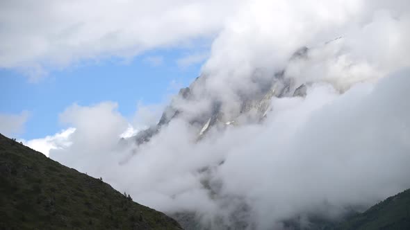 Beautiful Video Background Timelapse Video of Clouds Flowing Over High Mountains and Weather Changes