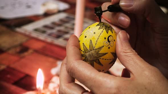 Female Craftsman Hands Creating Easter Egg