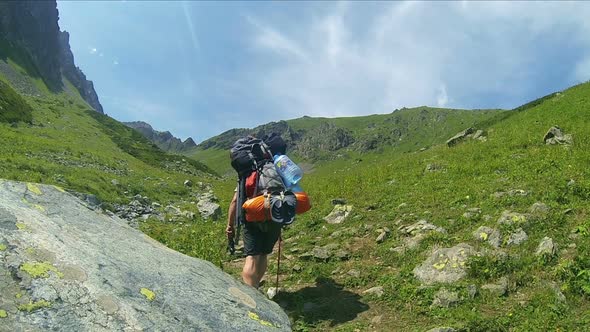 Tourist Man With Backpack In Mountain 7