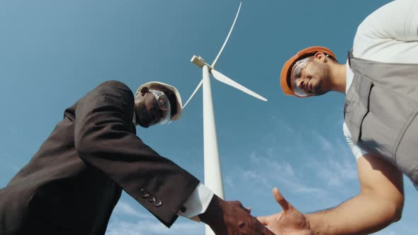 Close Up of Two Partners Engineers are Shaking Hands After Concluding a Good