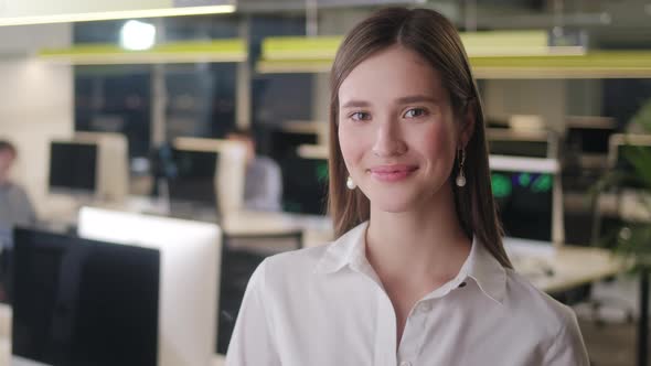 Front View of Beautiful Young Woman Professional Wearing White Shirt