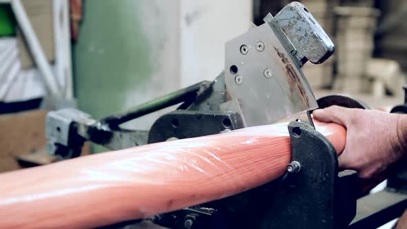 Worker cutting polypropylene Bristles at the Factory.