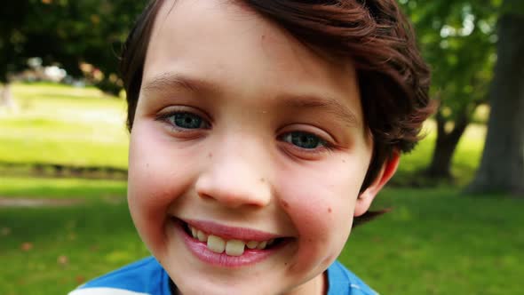 Portrait of smiling boy in park
