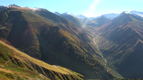 Natural Autumn Valley and Snowy Mountain Summit