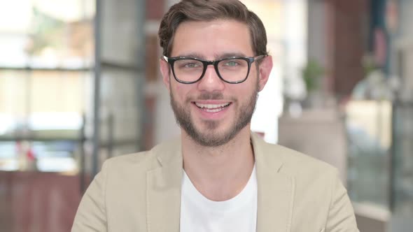 Young Man Smiling at Camera