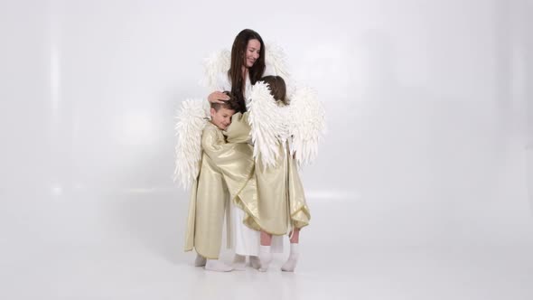 Happy Family with White Angel Wings on a White Background They are Happy