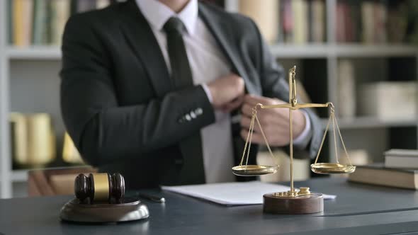 Close Up Shoot of Lawyer Hand Offering Money in Court Room