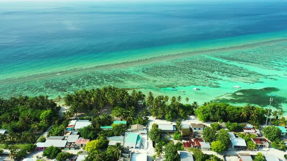 Beautiful drone copy space shot of a paradise sunny white sand beach and blue sea background in colo