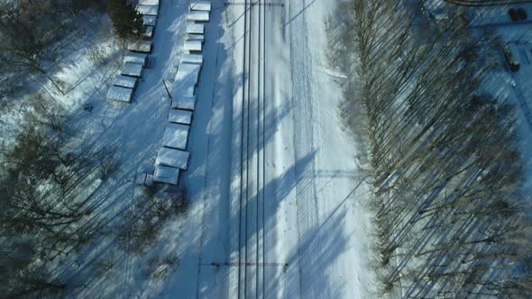 Flight Over The Railroad. With Camera Up. Winter Industrial Landscape. Aerial Photography.