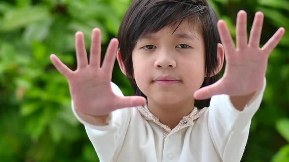 Asian Child Show Stop Hands Gesture For Stop