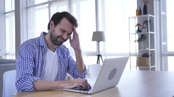 Headache Upset Tense Young Casual Beard Man Working in Office