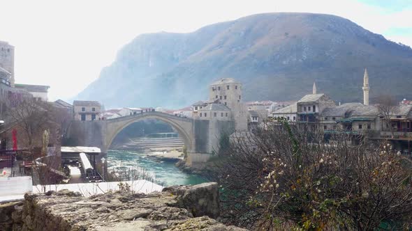 View of Old Town and Old Bridge in Mostar with a mountainous background
