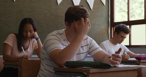 Teenagers in a school classroom alt