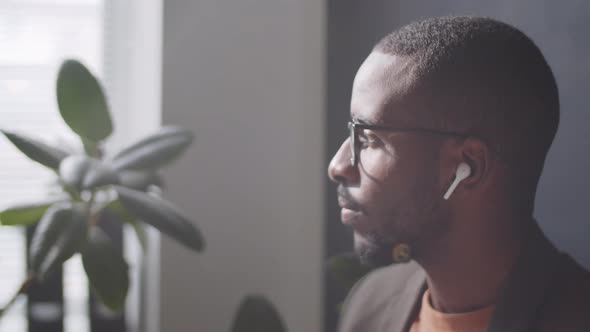 Portrait of Young Afro-American Businessman in Wireless Earphones