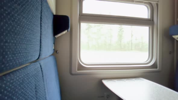 The Compartment Window of a Train the Nature Behind the Window the Movement of the Camera