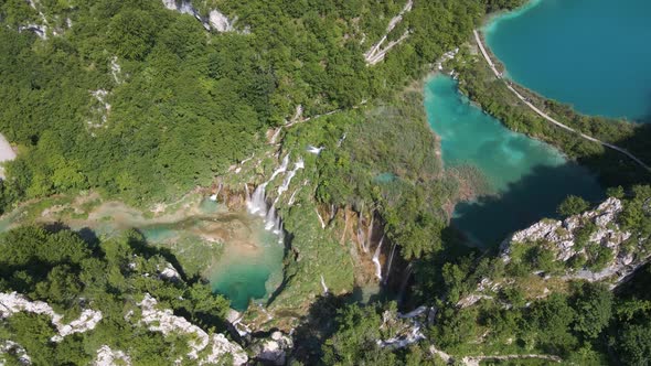 Top view of the beautiful Plitvice Lakes National Park with many green plants and beautiful lakes an