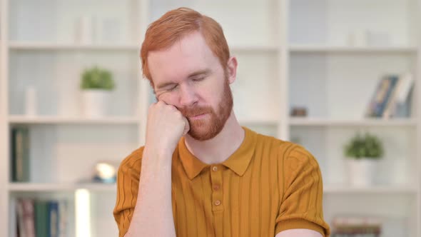 Portrait of Tired Redhead Man Taking Nap 