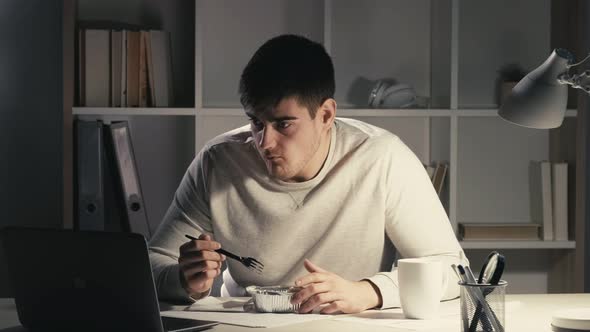 Late Dinner Male Student Eating at Night Workplace