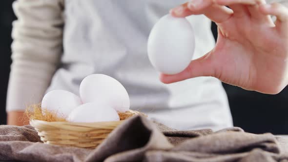 Woman holding white eggs 4k