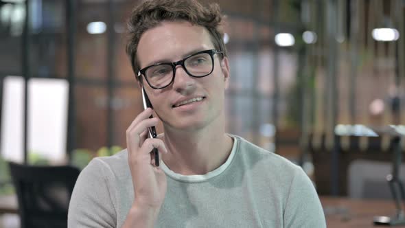 Portrait Shoot of Handsome Guy Talking on Smartphone