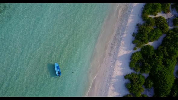 Aerial texture of beautiful tourist beach holiday by blue water with white sand background of a dayo