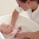 Mother bathing her baby - VideoHive Item for Sale
