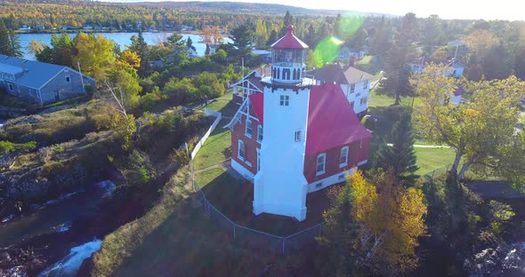 Aerial of Red and White Eagle Harbor Lighthouse on Michigan Lakes