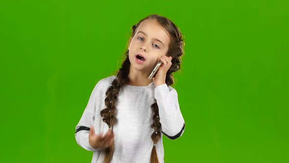 Child Is on the Phone. Green Screen