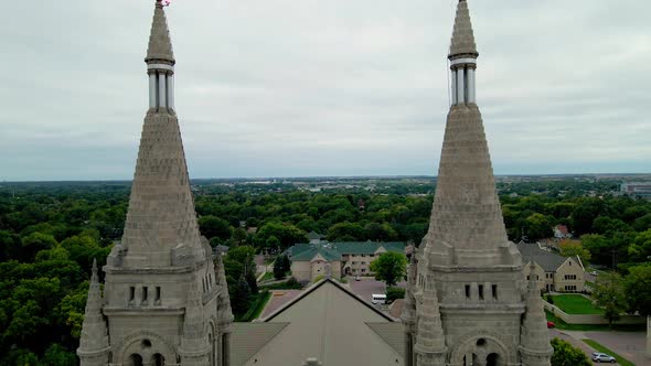 Drone view bringing front of cathedral into view. Intricate design on exterior of church.