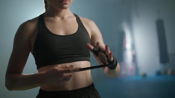 Female Fighter Wraps Her Hands with Boxing Bandages Kickboxing Training Day in a Gym Female Fighter