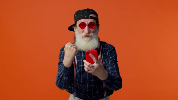 Elderly Bearded Man Use Mobile Phone Browsing Online Say Wow Yes Big Win News Doing Winner Gesture