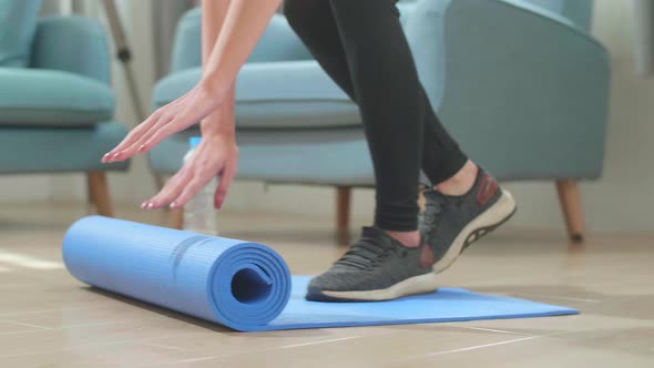 Asian Woman Roll Out Yoga Mat For Preparation, Female Work Out By Exercise Yoga At Home