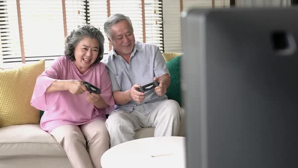 Senior adult playing video game