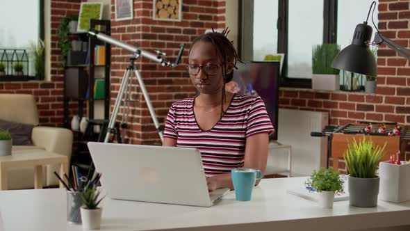 Young Freelancer Doing Remote Distant Work on Laptop Computer