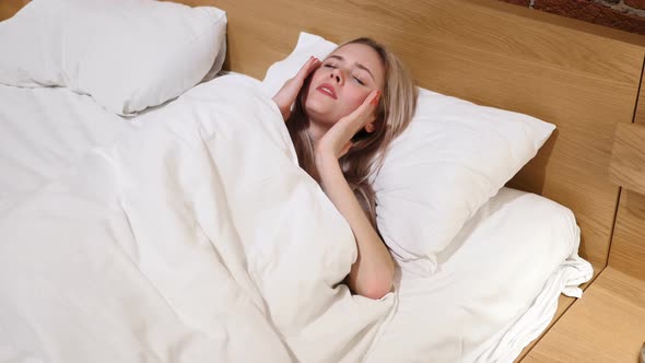 Headache, Woman with Pain in Bed Lying in Bed