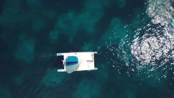 4k 24fps Cenital Drone Shoot Of The Catamaran In The Blue Water In The Caribbean In Sunny Day