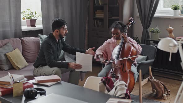 Girl Playing Double Bass with Tutor