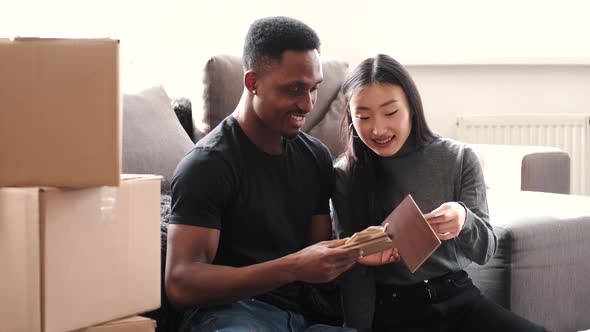 Couple Unpacking Boxes at Their New Home