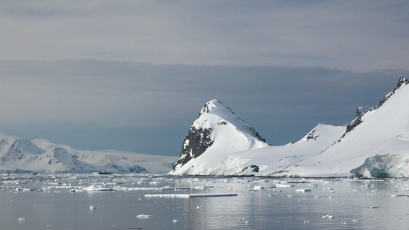 Antarctica. Sea mountains and large icebergs reflecting in the water. Fantastic wonderful amazing.