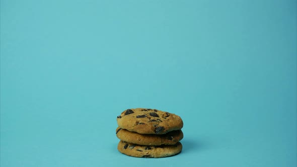 Pile of Cookies Decreasing and Increasing on Blue Background. Stop Motion Animation