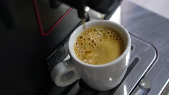 Preparation of Espress in Automatic Coffee Machine Adding Black Espresso