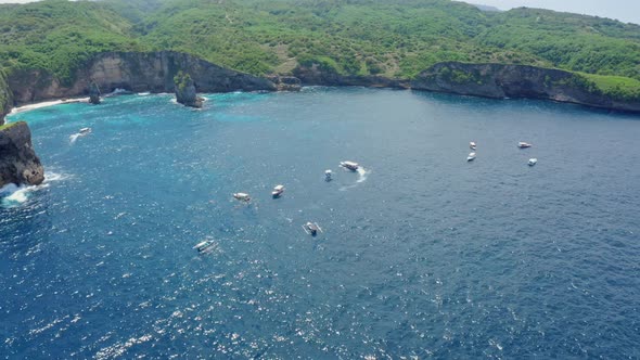 Aerial View of Boats Floating in Azure Ocean in Bay of Island Nusa Penida Bali