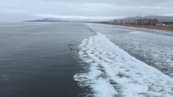 Surf training, Pacific Ocean (La Serena, Chile) aerial view, drone footage