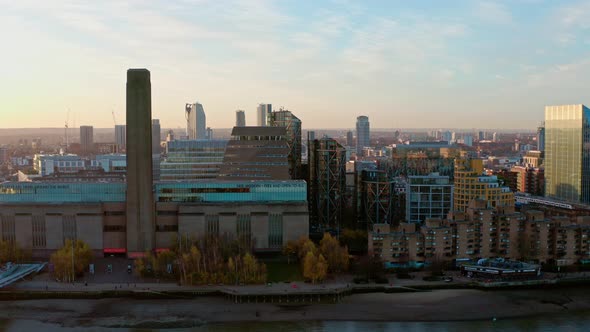 Descending aerial shot of Tate Modern Art Museum at sunrise